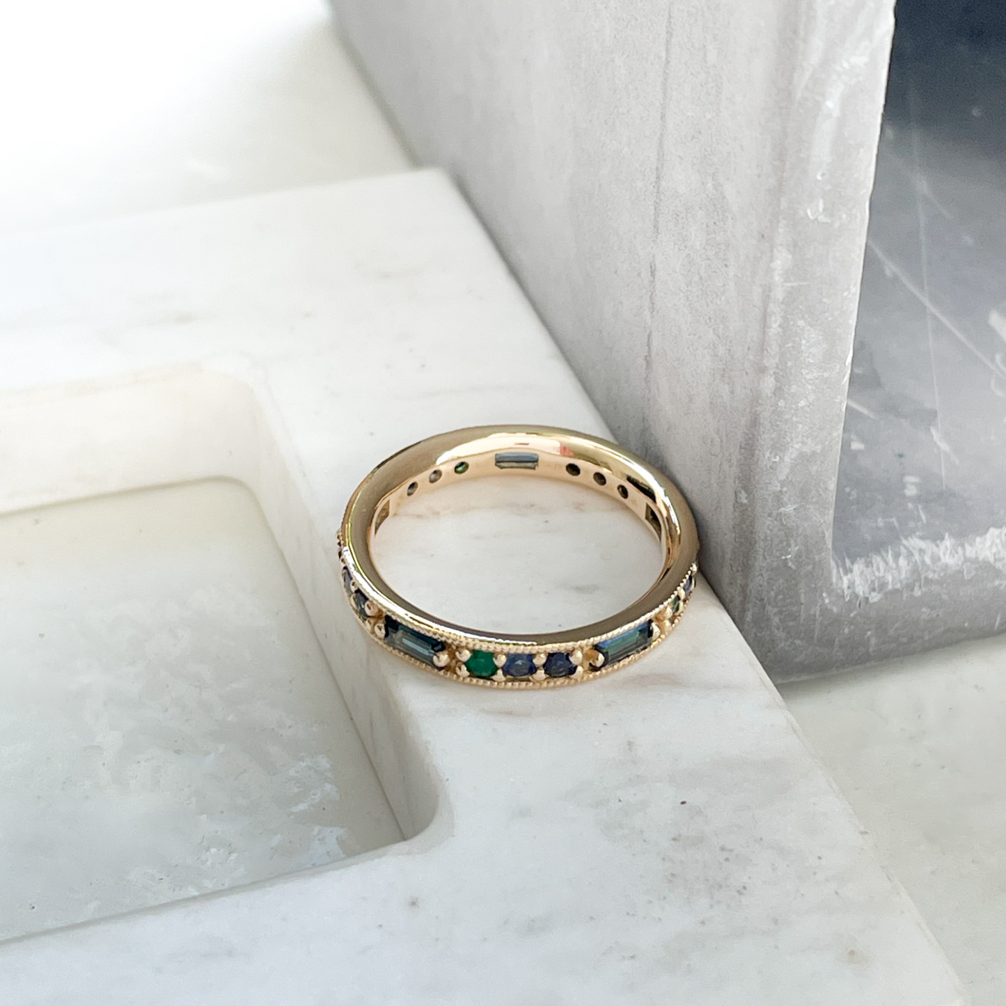 OctaHedron Jewelry Presidio Round Brilliant Cut Brazilian Emeralds, Royal, and Dark Blue Sapphires with Australian Teal Baguette Sapphire Sapphire Eternity Band Ring in 14k Yellow Gold