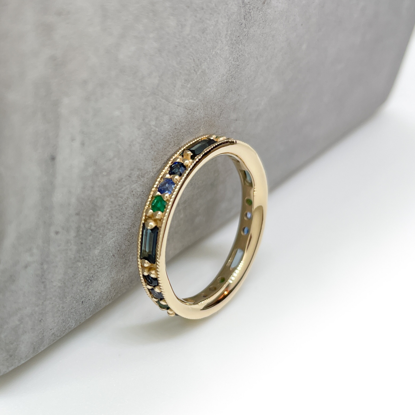 OctaHedron Jewelry San Francisco Made Presidio Eternity Band with Dark Green Brazilian Emerald, Teal Australian Baguette Sapphire, Royal Blue Sapphire, & Dark Blue Sapphire Ring